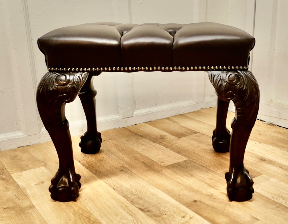 a 19th century carved walnut leather chesterfield library stool