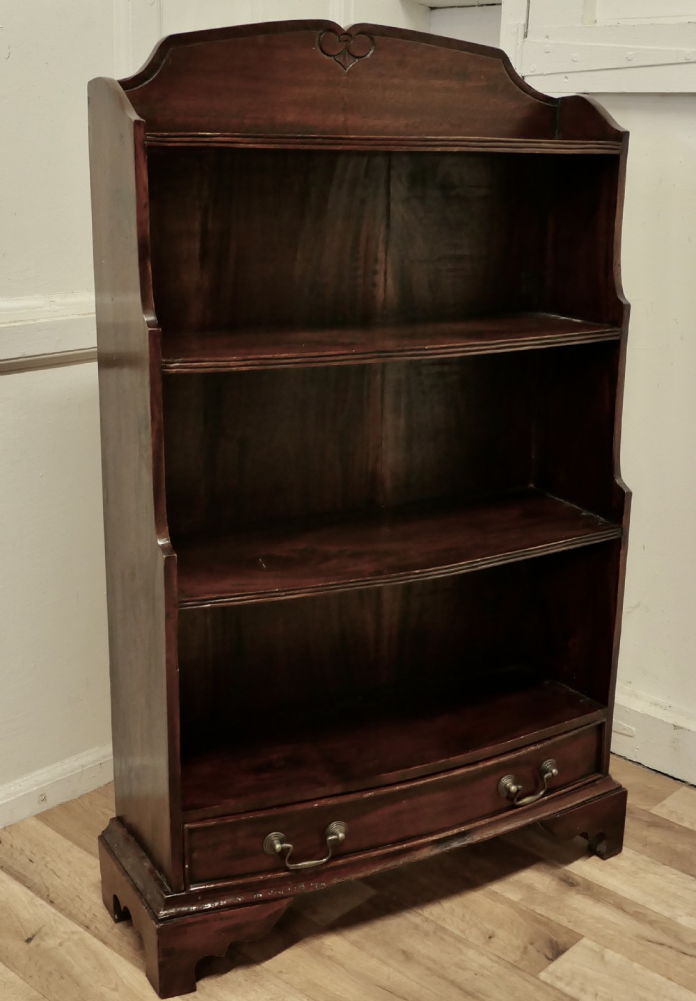 bow front open bookcase with drawer