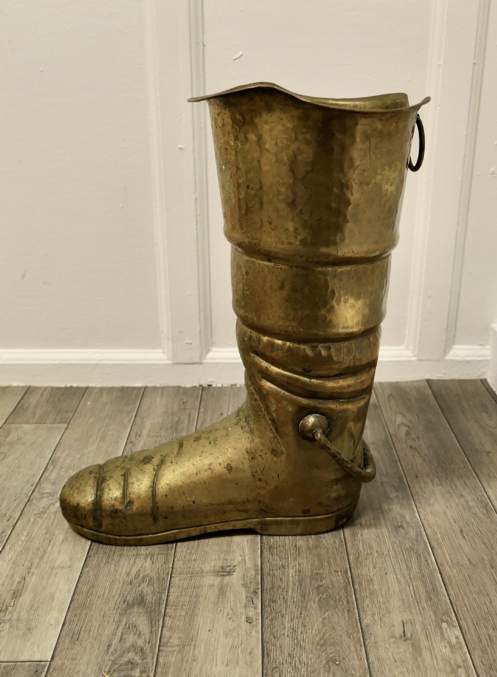 a very unusual stick stand a brass deep sea divers boot