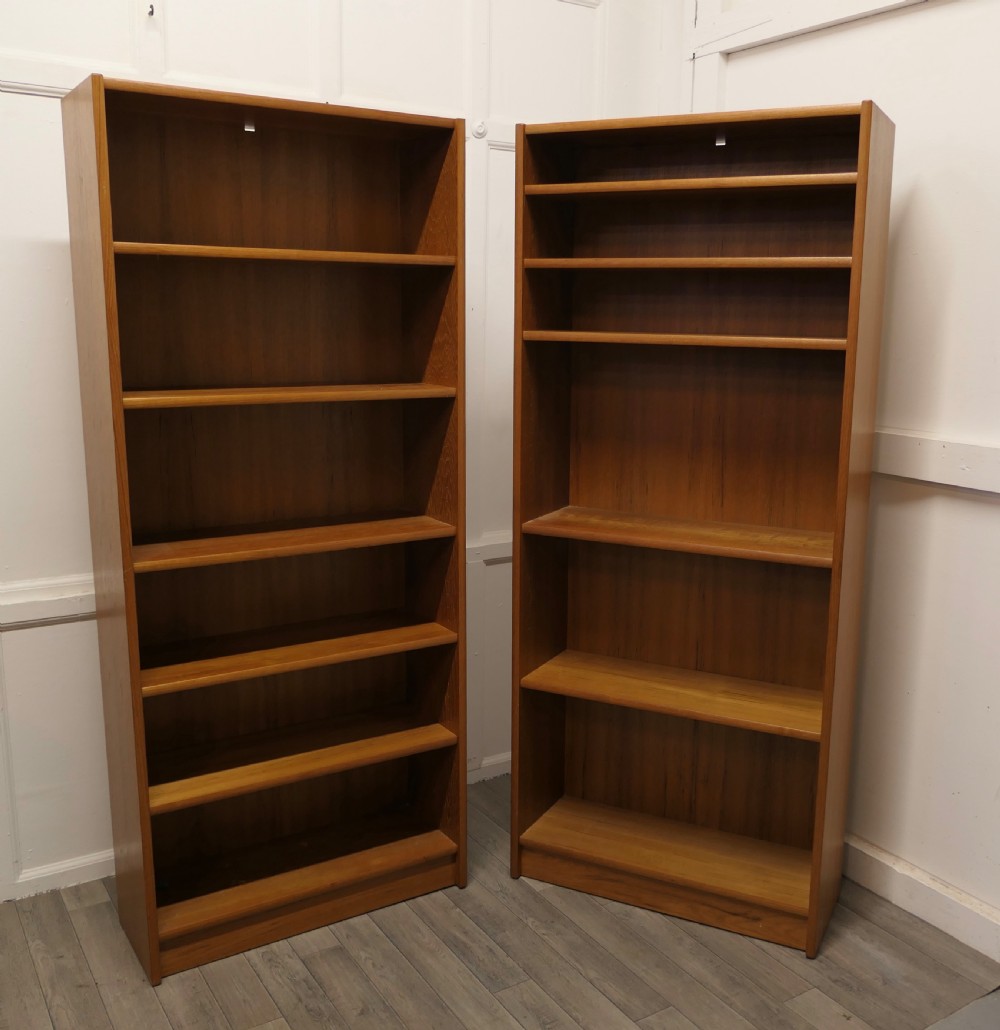 pair of 1980s vintage tall open book cases in teak finish