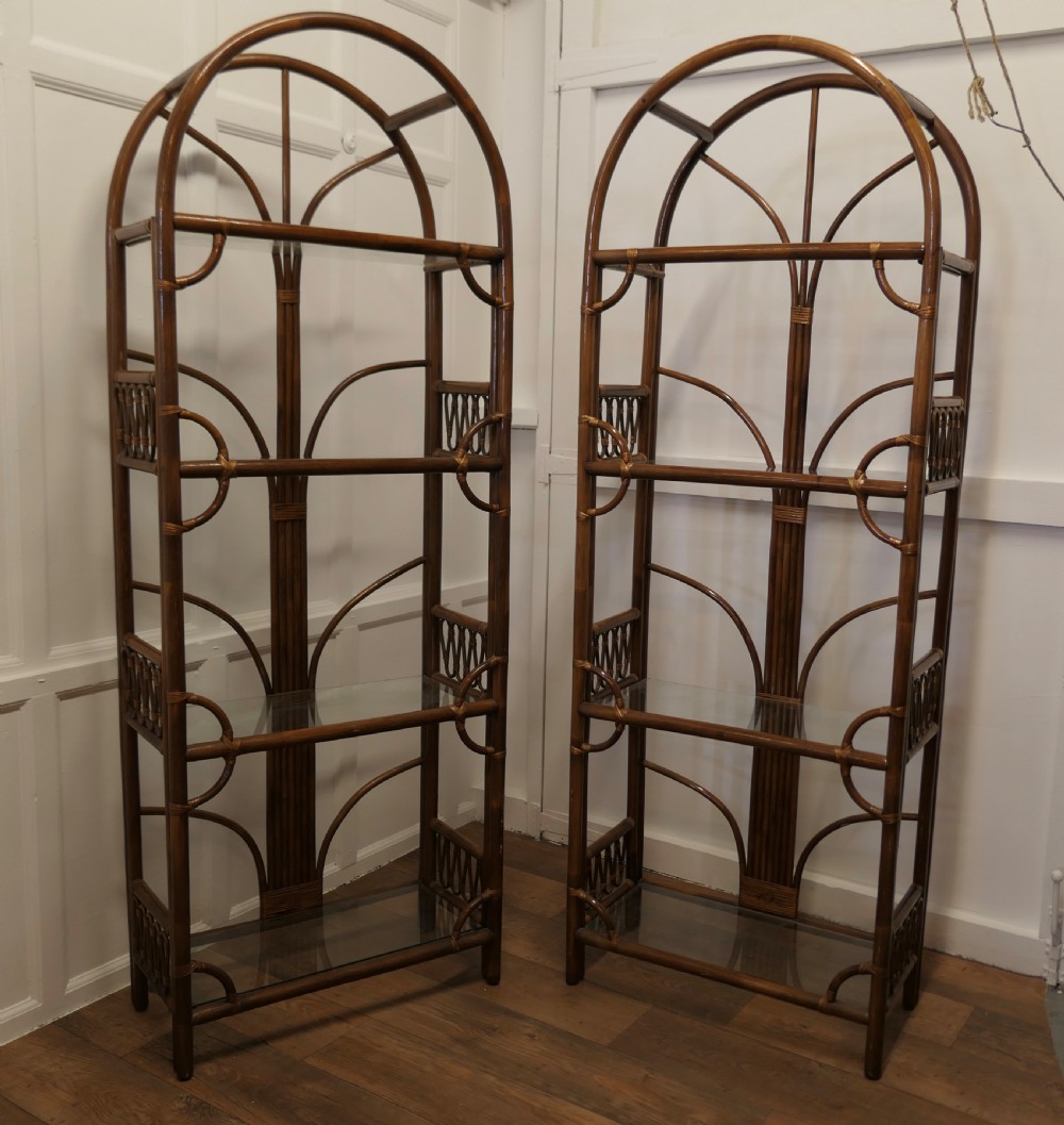 a pair of tall bamboo and glass bookcases room dividers