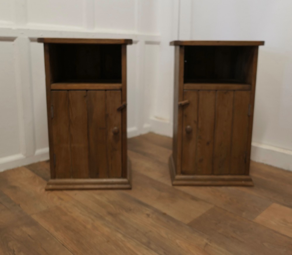 a pair of rustic pine bedside cupboards night tables