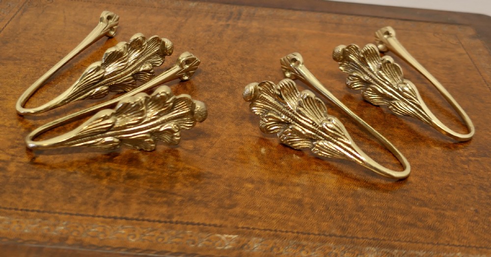 2 matching pairs of french brass curtain tie backs