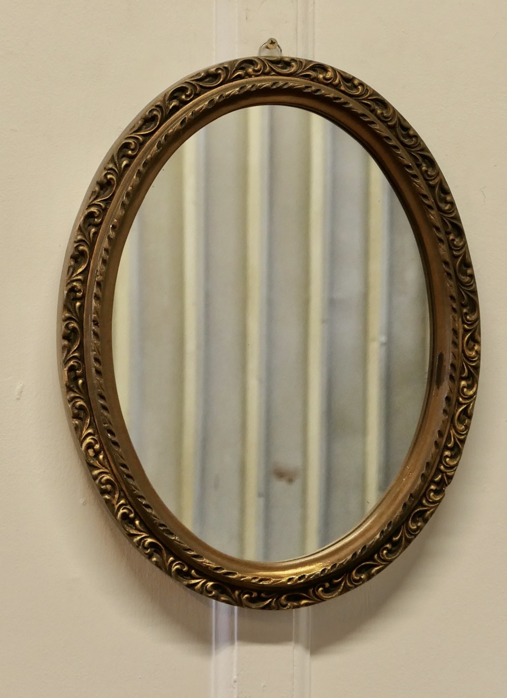 pretty gilt oval mirror