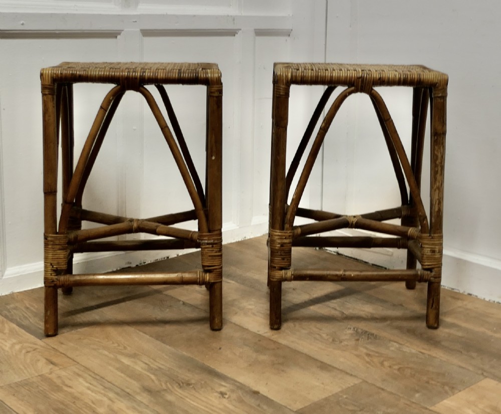 a pair of bamboo high stoolstables or window seats