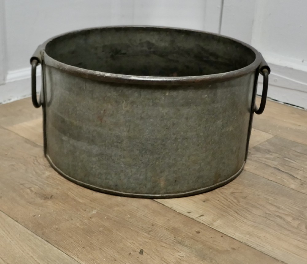 large zinc and iron cauldron log basket