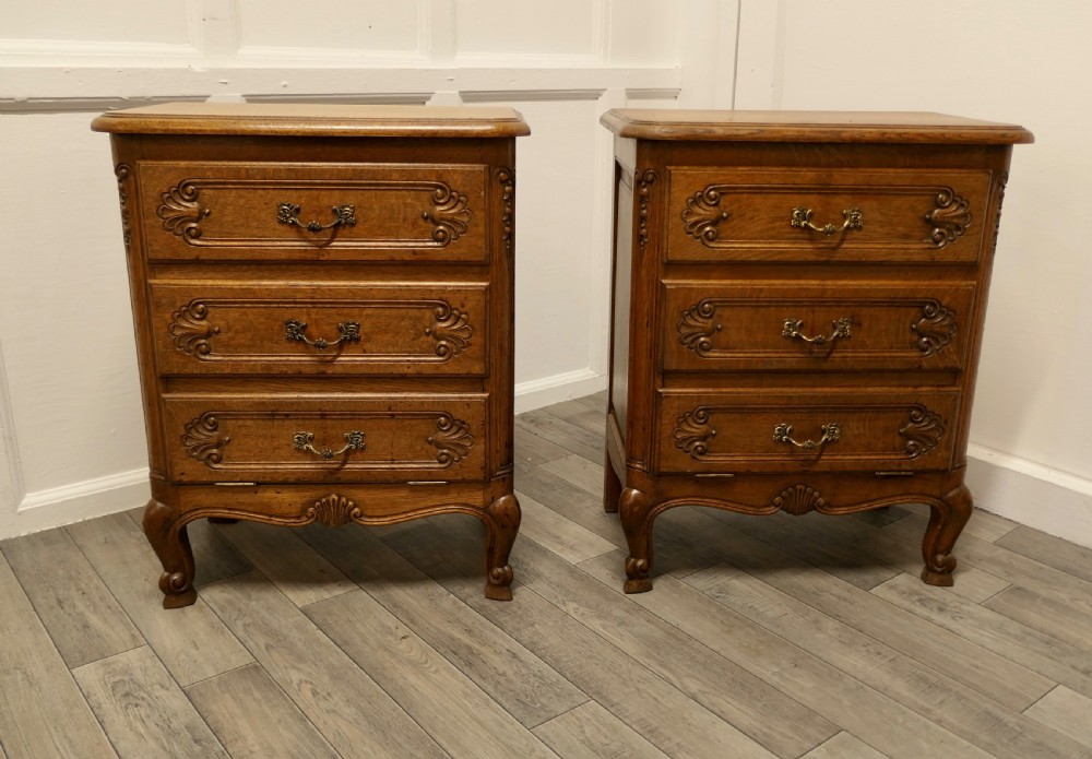 a pair of small french golden oak chests of drawers
