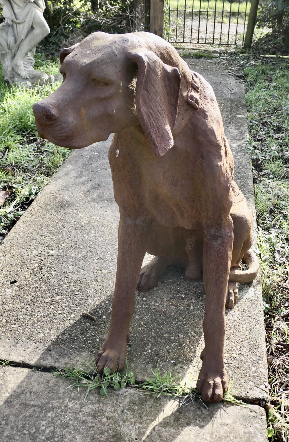 lifesize weathered cast iron statue of a hunting dog
