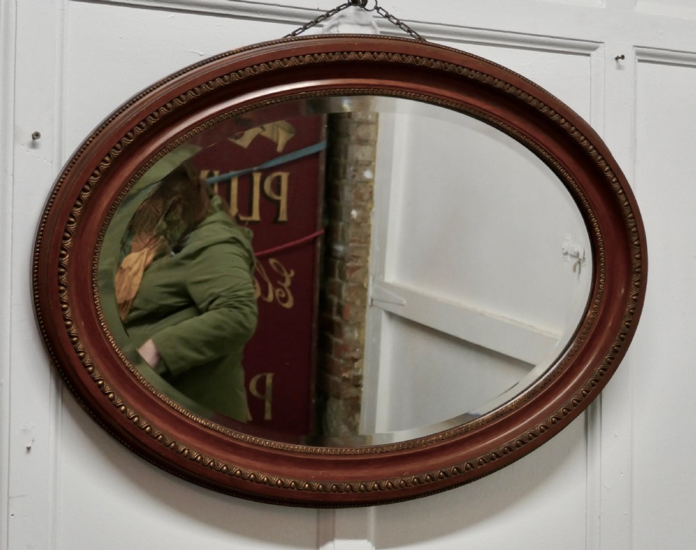 edwardian simulated oak finish oval mirror