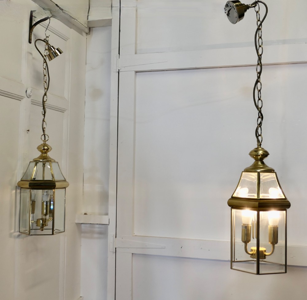 a pair of art deco style brass glass hall lanterns