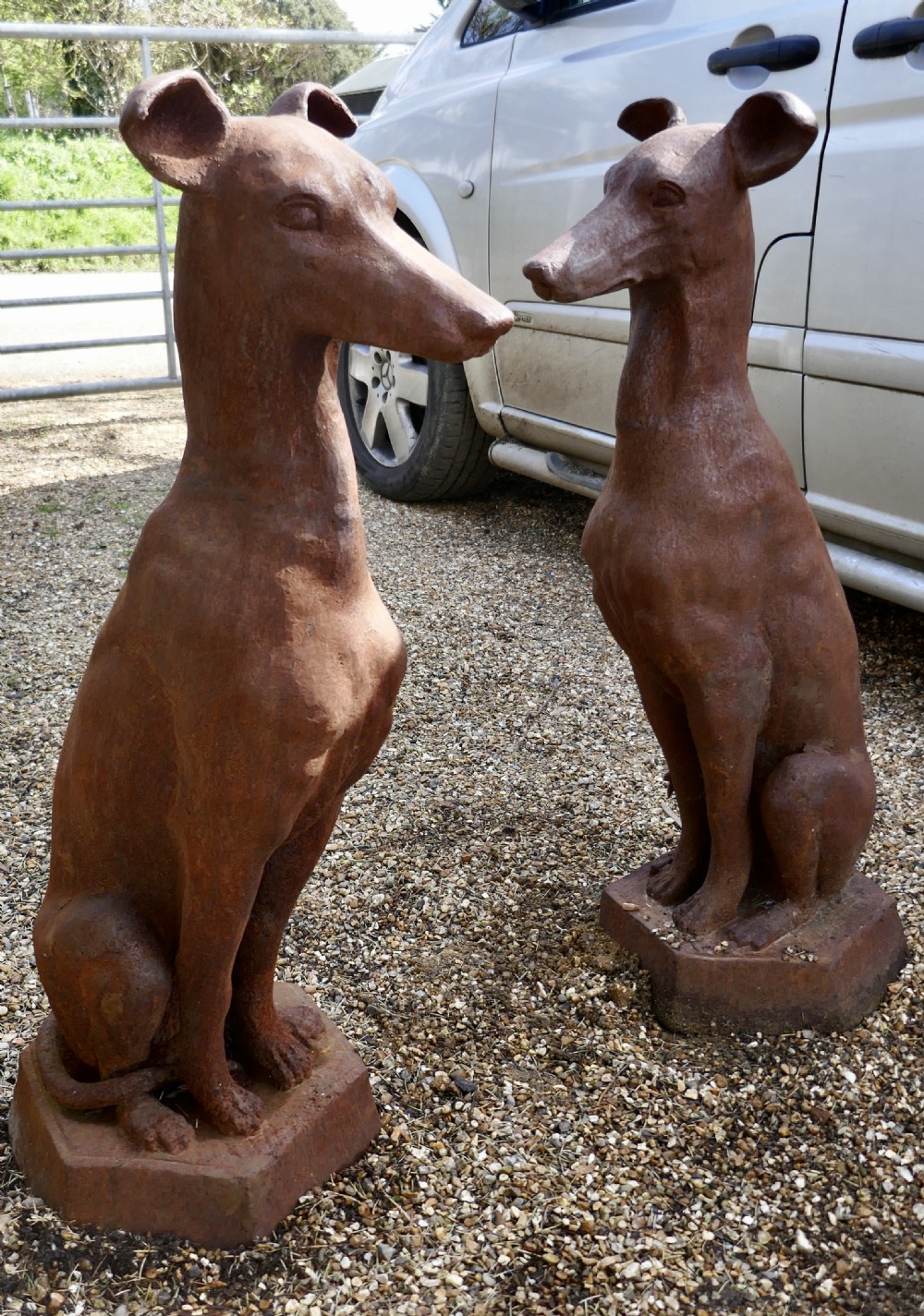 pair of greyhound guard dogs natural rust weathered in cast iron