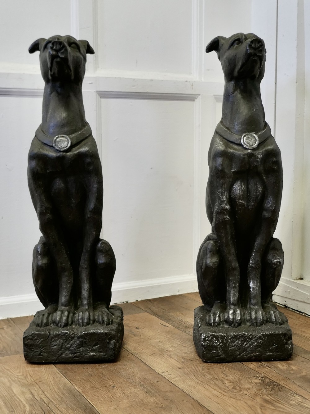 pair of large sculptured greyhound dogs
