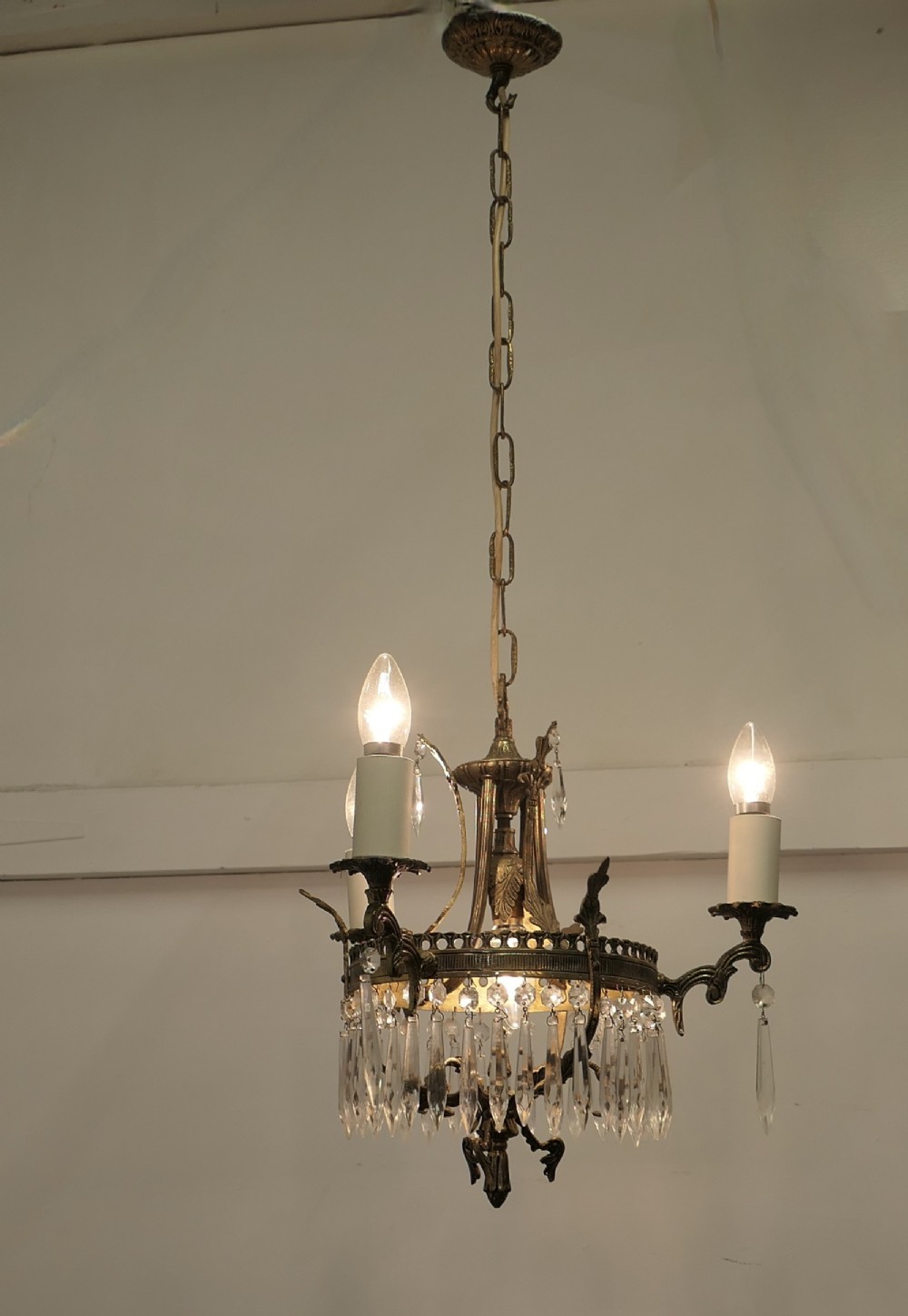 a stunning 3 branch brass and crystal chandelier