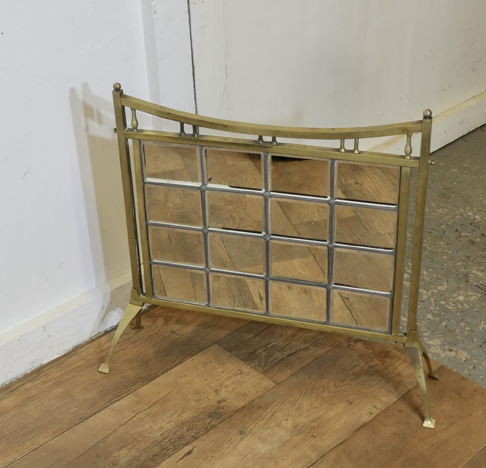 a victorian brass and mirror arts and crafts fire screen