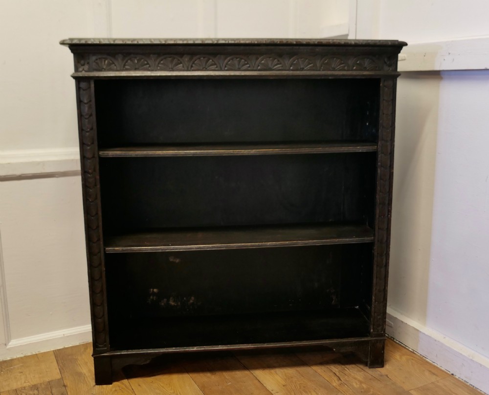 carved oak open bookcase