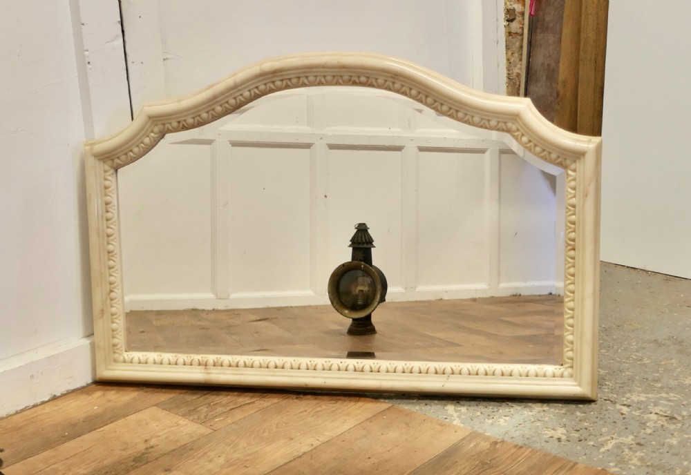 a superb large carved simulated marble overmantel mirror