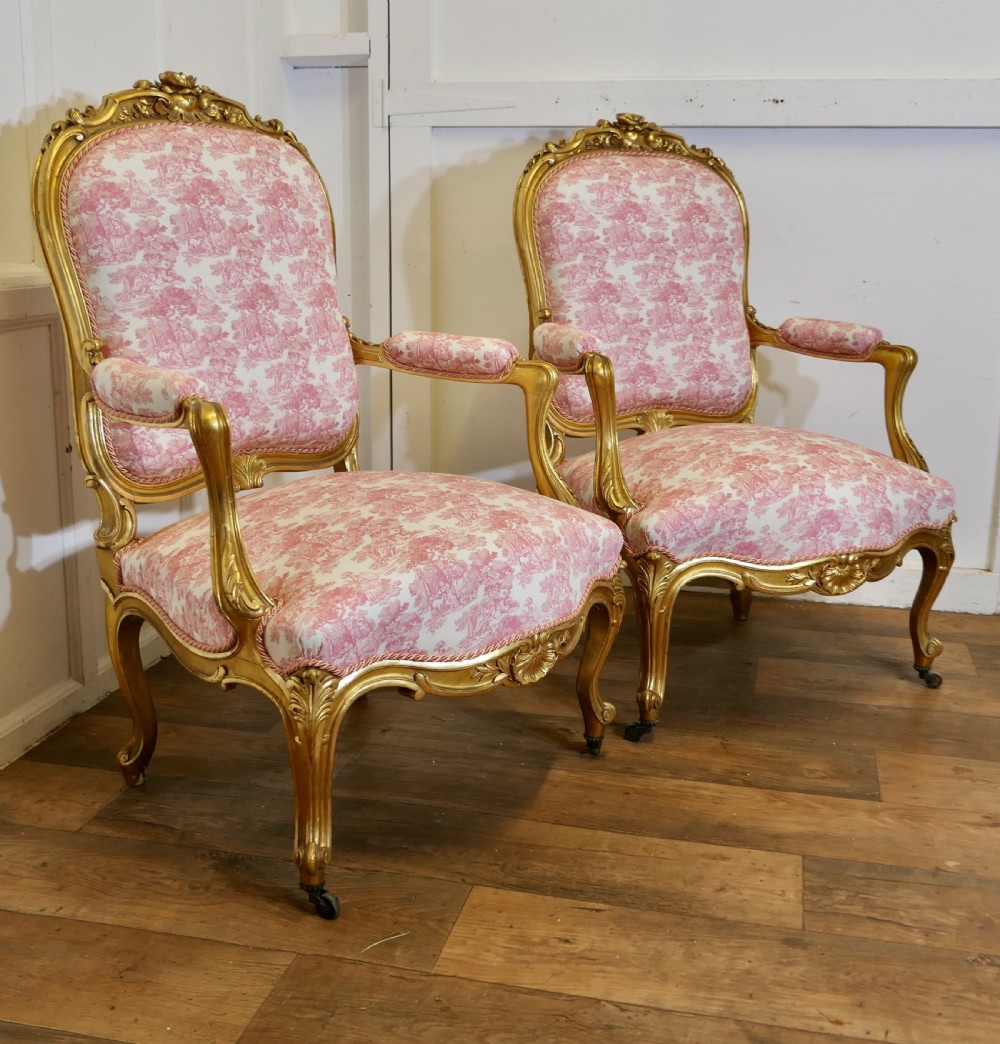 a superb pair of french napoleon iii gilt salon chairs