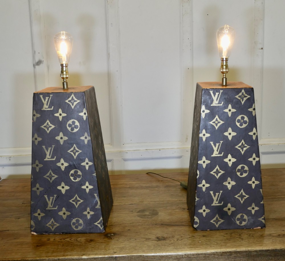 a pair of terracotta painted lamps for a trade display