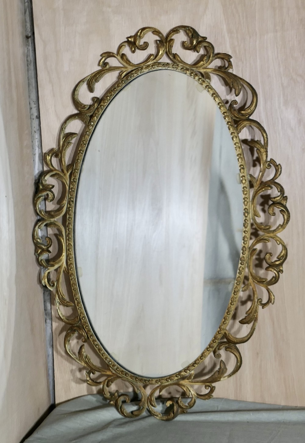 large oval rococo style ornate gilt wall mirror