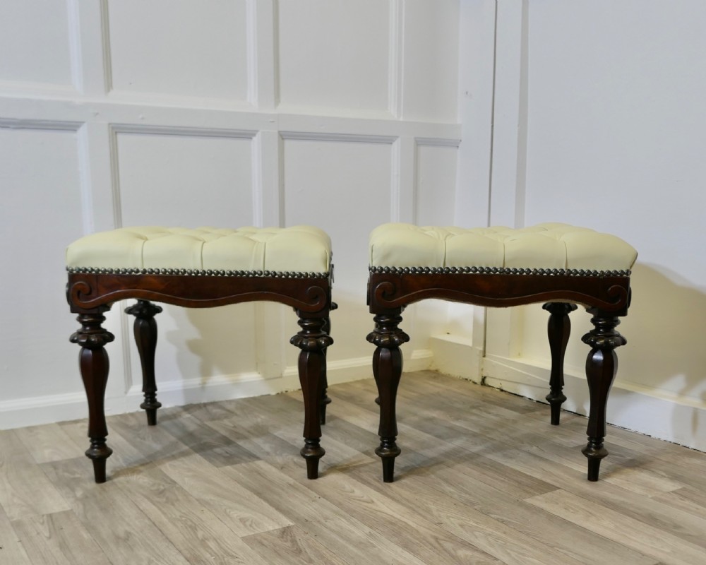 a pair of chesterfield buttoned leather walnut library window stools