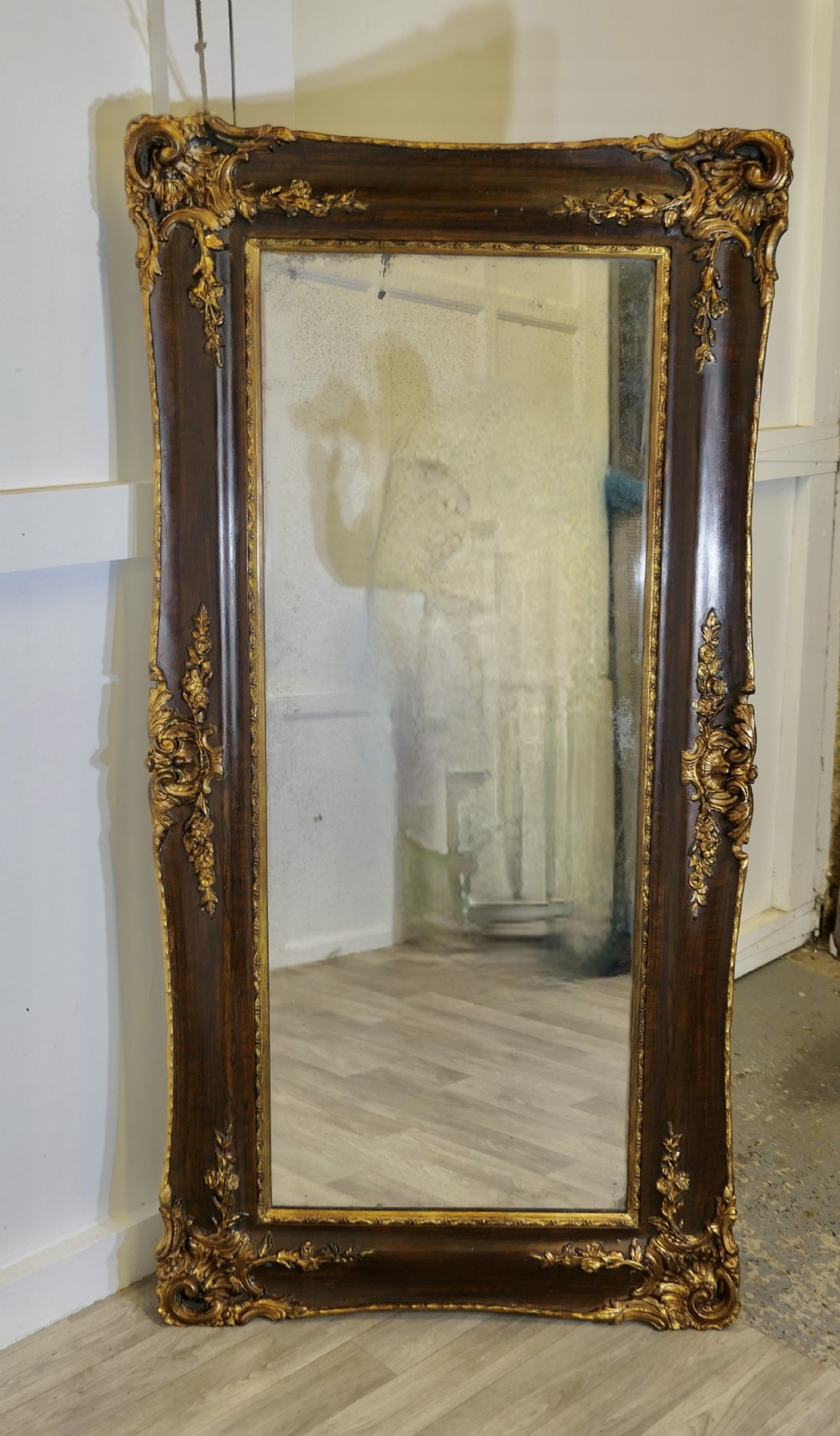 large rectangular decorative gilt and wood wall mirror