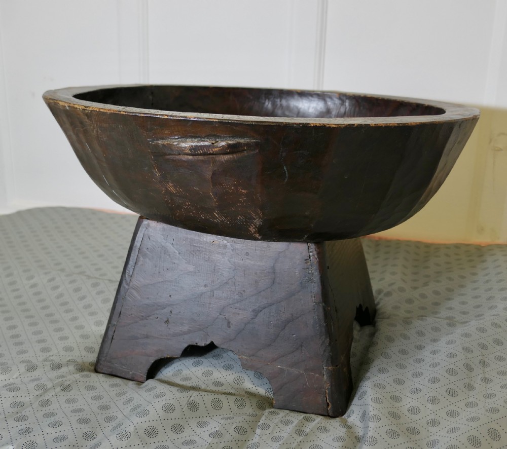 large oriental hand carved wooden bowl on stand