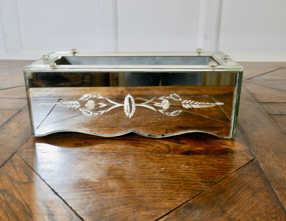 an etched venetian mirrored planter trough