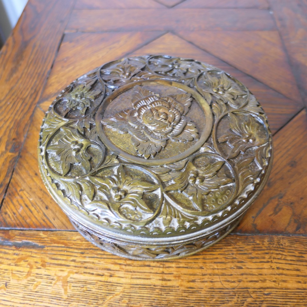 round walnut box profusely carved with roses