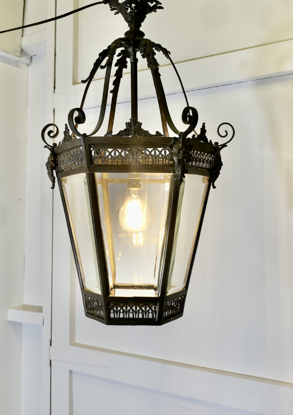 an old decorative green man copper lantern