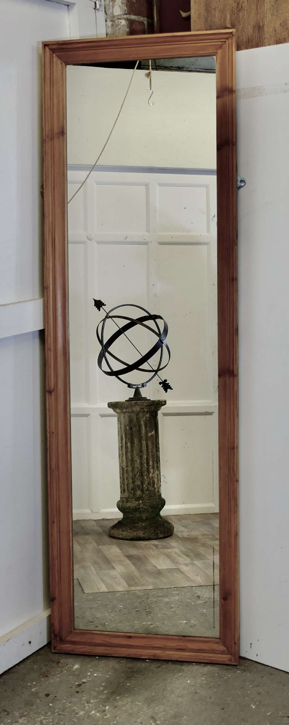 full length pine wall mirror with a moulded pine frame