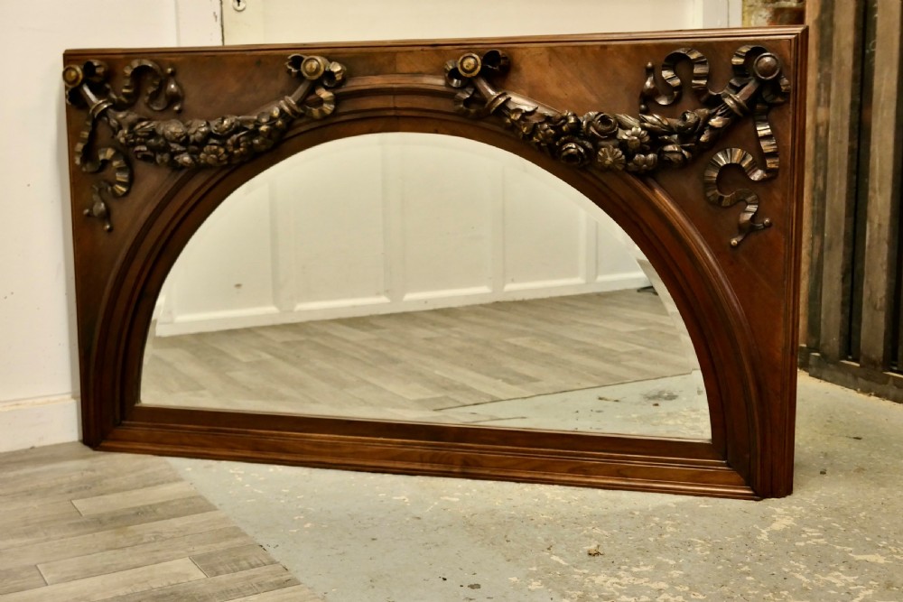 large carved walnut arched overmantel mirror