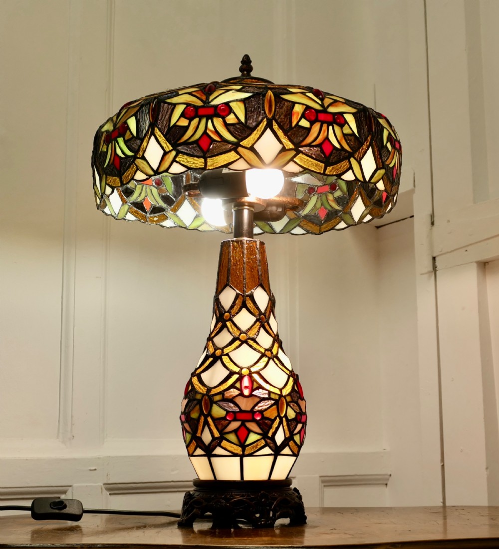 a large tiffany style stained glass table lamp and shade