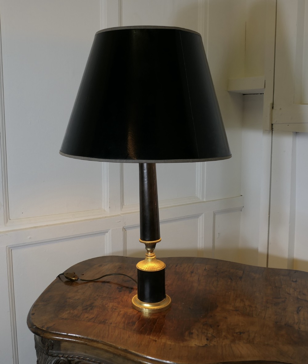 an art deco brass and black leather table lamp