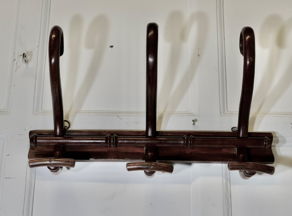 row of 3 bentwood hat and coat hooks