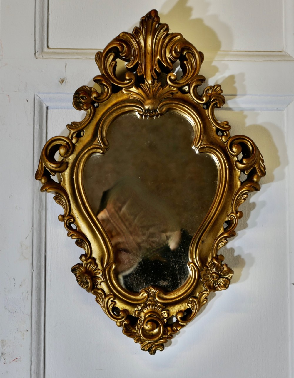 attractive rococo style small gilt wall mirror