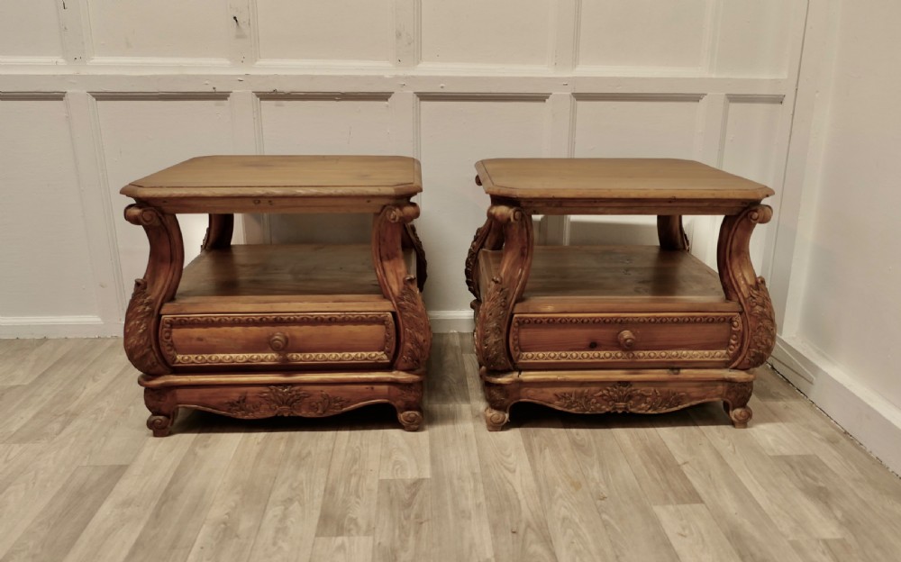 a pair of heavy pine low side tables or bedside cabinets