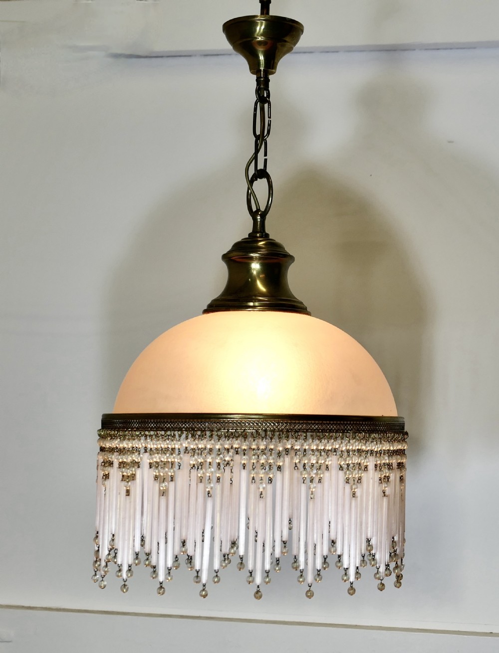 french art deco pink glass light with beaded shade