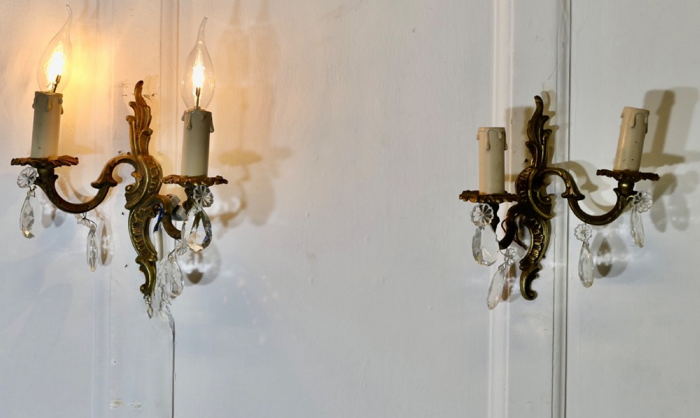 a pair of french brass twin wall lights