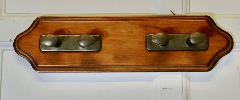 bronze hat and coat hooks on a nautical theme