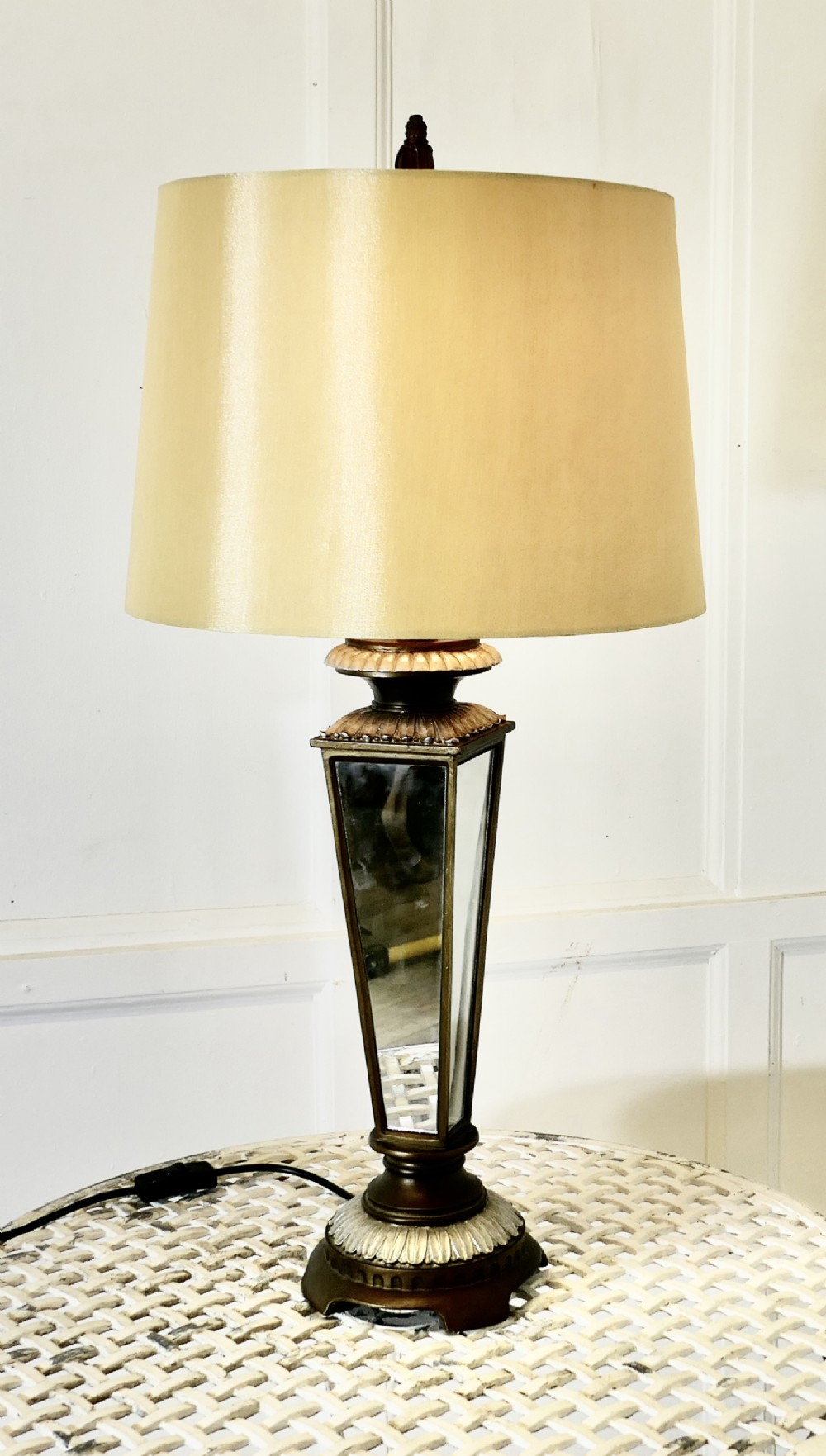 an art deco style mirror table lamp